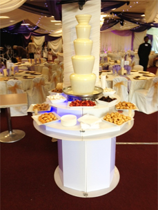 White Chocolate Fountains on display with Fruit and Sweets